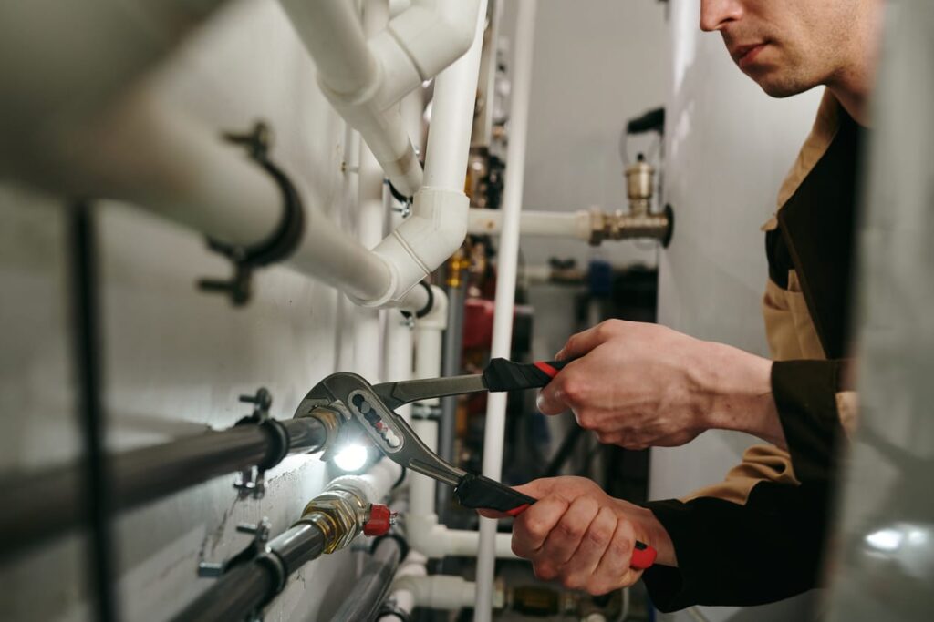 Plumbers maintaining commercial plumbing pipes in The Villages